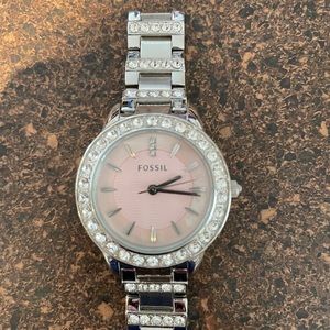 Silver fossil watch with diamonds around the face